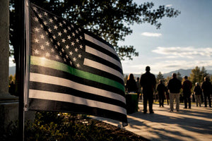 Thin green line flag at memorial gathering