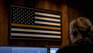 Thin gold line flag in dispatch center