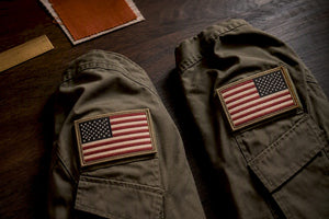 Two sleeve patches showing opposite flag orientations