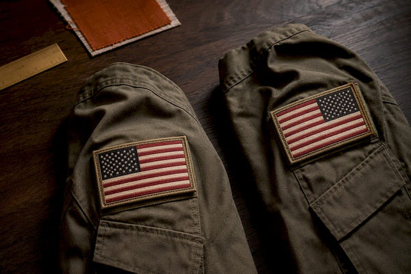 Two sleeve patches showing opposite flag orientations