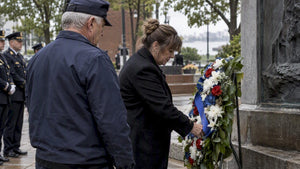 Survivor placing wreath at Police Week memorial