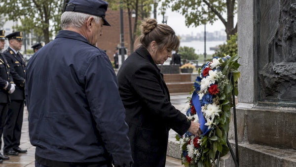 Survivor placing wreath at Police Week memorial