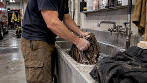 Firefighter washing diesel-smelling work shirt
