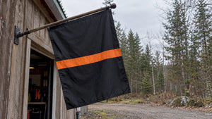 Thin orange line flag outside SAR shed