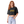 A woman with red hair wearing a dark charcoal gray cropped t-shirt with 'STAY SALTY' printed in yellow across the chest, paired with light blue jeans, against a plain white background.